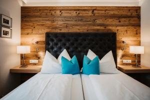 Postel nebo postele na pokoji v ubytování Hotel Happy Filzmoos