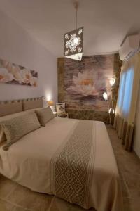 A bed or beds in a room at La Casedda di Catalina