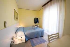 Postel nebo postele na pokoji v ubytování Le Petit Hotel