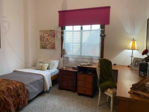 Posteľ alebo postele v izbe v ubytovaní Casa Charry