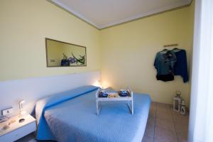 Postel nebo postele na pokoji v ubytování Le Petit Hotel