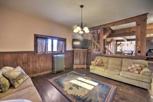 a living room with a couch and a table at Country Escape with Sauna, 10 Mi to Cooperstown in Richfield Springs