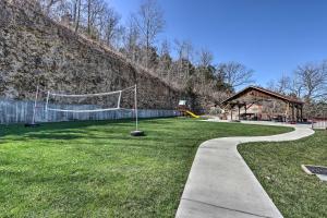 a park with a volleyball court and a net at Serenity at the Lake Ozarks Gem with Pool Access in Camdenton