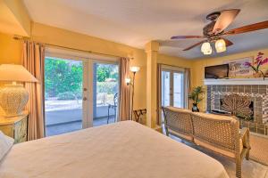 a bedroom with a bed and a ceiling fan at Lido Key Hideout with Patio and Yard and Walk to Beach! in Sarasota