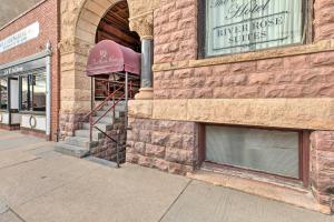 a store front of a brick building with a window at Pet-Friendly Apt 2 Blocks to Riverside Park! in Yankton