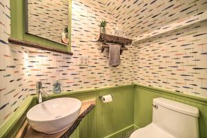 a bathroom with a white toilet and a sink at 1 Block to Downtown Cozy Condo by Mirror Lake in Lake Placid +16 photos