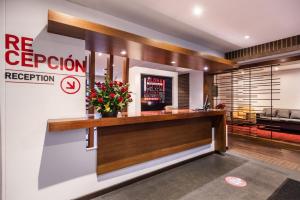 a reception area of a hotel with a reception desk at AZ Hotel in Bogotá