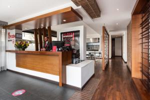 a large kitchen with a large window at AZ Hotel in Bogotá