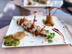 a white plate with food on a table at Cuba Beach Hotel in Side