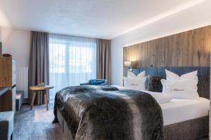 Postel nebo postele na pokoji v ubytování Hotel Sonnblick