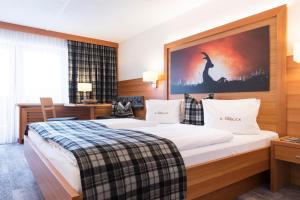 Postel nebo postele na pokoji v ubytování Hotel Sonnblick
