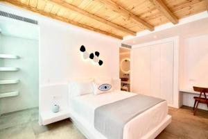 Posteľ alebo postele v izbe v ubytovaní Blue Orchid Villa Mykonos