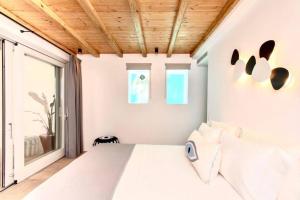 Posteľ alebo postele v izbe v ubytovaní Blue Orchid Villa Mykonos