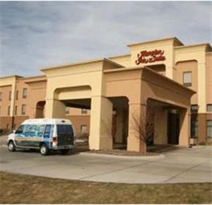 a van parked in front of a building at Hampton Inn & Suites Scottsbluff in Scottsbluff