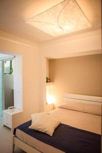Posteľ alebo postele v izbe v ubytovaní Terrazza Isola Bella Taormina (Mazzarò)