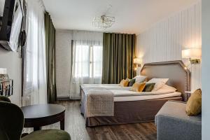 Postel nebo postele na pokoji v ubytování Högbo Brukshotell & Spa