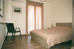 Postel nebo postele na pokoji v ubytování Seastone Villas