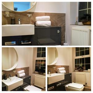 a bathroom with two sinks and a mirror at Relaxing En-suite Double Room in Derby