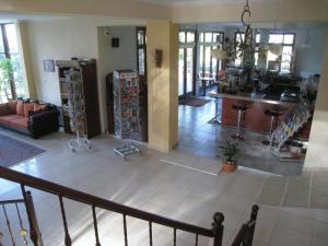a large living room with a kitchen and a living room at Evridiki in Vergina
