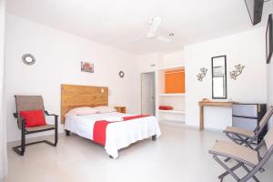 Postel nebo postele na pokoji v ubytování Hotel Casa Ariana