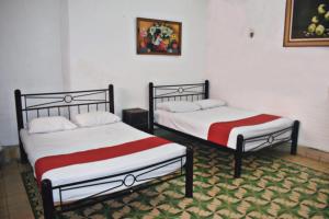 Postel nebo postele na pokoji v ubytování Hotel Margarita