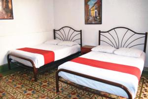 Postel nebo postele na pokoji v ubytování Hotel Margarita