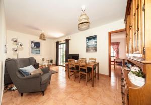 a living room with a couch and a dining room at Luxury Diving Apartment in Puerto del Carmen