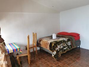 Katil atau katil-katil dalam bilik di Hotel Villa Tzankujil