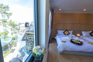 Postel nebo postele na pokoji v ubytování Anasia Hotel
