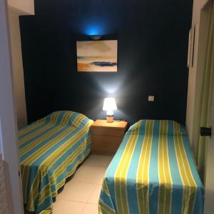Vilamoura Central Apartmentにあるベッド
