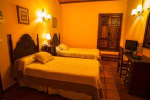 Posteľ alebo postele v izbe v ubytovaní Hotel Bodega La Venta