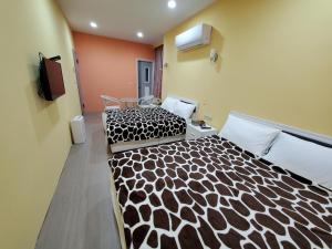 Postel nebo postele na pokoji v ubytování 芽哦小窩Ya OH Rooms