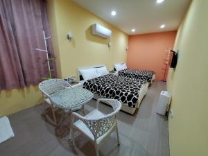 Postel nebo postele na pokoji v ubytování 芽哦小窩Ya OH Rooms