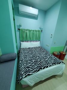 Postel nebo postele na pokoji v ubytování 芽哦小窩Ya OH Rooms
