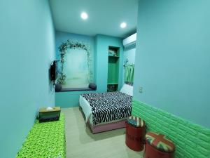 Postel nebo postele na pokoji v ubytování 芽哦小窩Ya OH Rooms