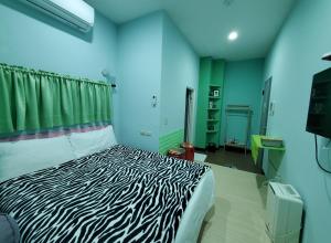 Postel nebo postele na pokoji v ubytování 芽哦小窩Ya OH Rooms