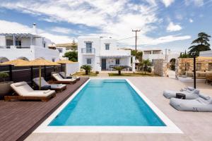 a villa with a swimming pool in front of a house at Villa Vanta in Drios