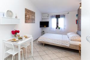 Postel nebo postele na pokoji v ubytování Ananas Apartments