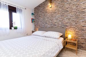 Postel nebo postele na pokoji v ubytování Ananas Apartments