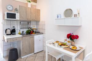 Kuchyň nebo kuchyňský kout v ubytování Ananas Apartments
