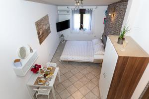 Postel nebo postele na pokoji v ubytování Ananas Apartments
