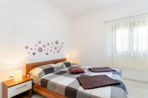 Postel nebo postele na pokoji v ubytování Ananas Apartments