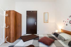 Postel nebo postele na pokoji v ubytování Ananas Apartments