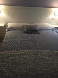 Letto o letti in una camera di La Linea D'Acqua
