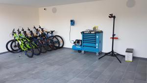 a group of bikes lined up against a wall at Hotel Alla Dolina in Sistiana