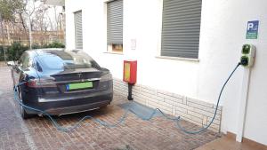 a car is hooked up to a charging station at Hotel Alla Dolina in Sistiana