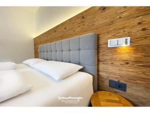 
Ein Bett oder Betten in einem Zimmer der Unterkunft Ferienwohnungen Falkenstein Hinterglemm
