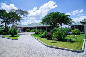 a building with a walkway in front of it at Unji Lodge in Ndola