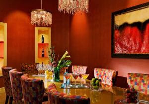 a dining room with a table and chairs with wine glasses at The Exeter Inn in Exeter