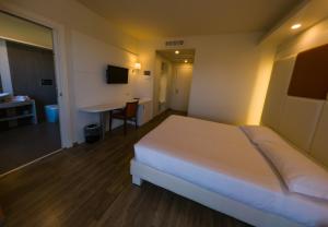 Tempat tidur dalam kamar di Hotel Sirio - Sure Hotel Collection by Best Western